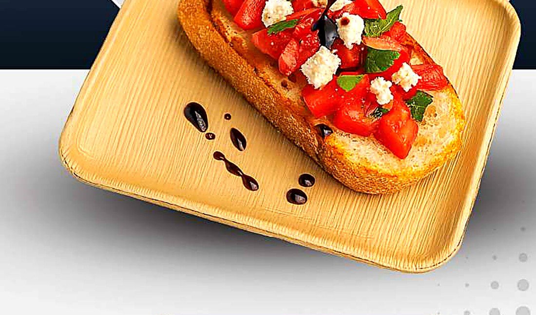 Bruschetta served on a palm leaf plate