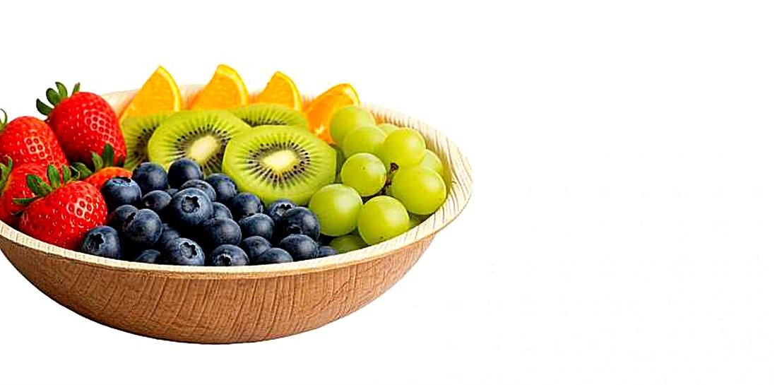 Fresh fruit served in a palm leaf bowl